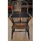 A 19th Century sycamore and oak spindle back country kitchen armchair, with wheel central spindle, H