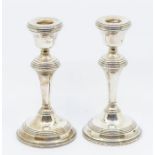 A pair of Modern silver candlesticks, hallmarked by Barker & Co., Birmingham, 1965, loaded, 18cm