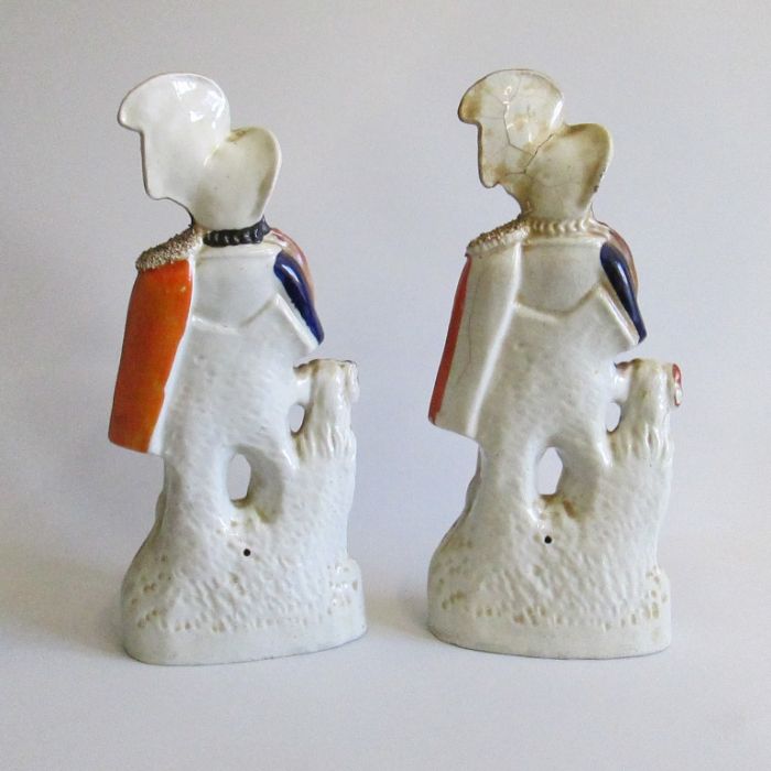 Two Staffordshire figures of a huntsmen with feathers in their hats, rabbit on shoulders and dogs ( - Image 2 of 2