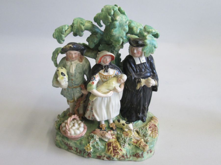 A Staffordshire Tithe Pig Group along with a small Staffordshire Cherub holding a basket of flowers, - Image 3 of 5