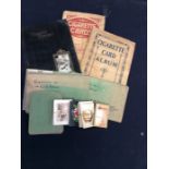 A qty of 1920/1930's cigarette cards, loose and in albums, cricket, dogs, ceramics, celebrities