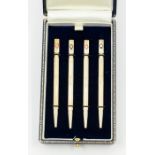 A set of four sterling silver propelling Bridge pencils, each with block terminal engraved with