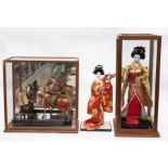 Three 20th Century Oriental figural settings, two cased