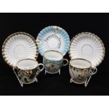 A group of three Continental probably Finish Art Nouveau moustache cup and saucers, Helsinki,