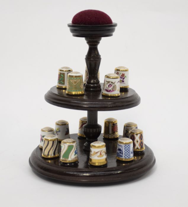 A collection of 15 Royal Crown Derby thimbles on a wooden display case stand with a pin cushion (all - Image 2 of 2