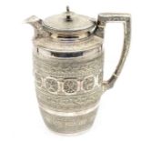 A late 19th / early 20th Century silver plate tapering cylindrical water jug, the body profusely