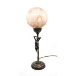 Art Deco style table lamp depicting nude female figure on base with leaf decoration. Signed