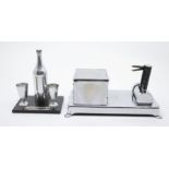 Chrome cigarette dispenser along with table lighter and vespa holder in chrome, in the style of a