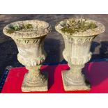 A pair of antique weathered garden urns Height 39cm both in good order , weathered