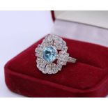 An Art Deco blue zircon and diamond platinum dress ring, the pierced rectangular head set central