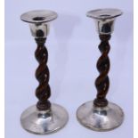 A pair of silver mounted barley twist candlesticks, Chester hallmark