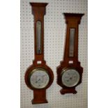 Three mid 20th century walnut and oak barometer thermometers, H74 to 57cm