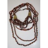 Four Amber coloured bead necklaces (untested) weighing 364g gross