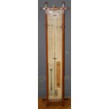 An Admiral Fitzroy barometer in typical oak case, H105cm