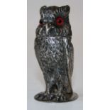 A Victorian silver novelty pepper in the form of a standing owl with glass eyes, London 1873 H8cm