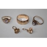 A large 9mm wedding band, size X, a pair of trefoil earrings and two paste set rings. All items bear