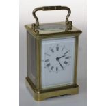 A large 20th century brass, five glass carriage timepiece, the eight day movement faced by enamel