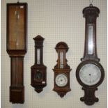 An Admiral Fitzroy type barometer, H95cm, an oak barometer thermometer H92cm, another smaller and