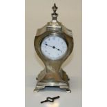 An Edwardian silver cased mantel timepiece having a lever platform movement and enamel dial,