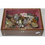 A late Victorian rosewood jewellery box, containing various bijouterie and other items including