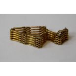 A five link gold bracelet with similar links, assumed to be 9ct, width 9cm clipped, 14gm To be