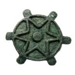 Roman disc brooch, 2nd century AD. A bronze disc brooch with six peripheral lugs, the front face