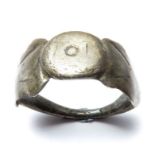 Roman silver ToT ring. A silver finger ring having flared sub-triangular shoulders and a flat