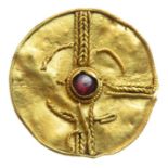 Anglo-Saxon Pendant.  Circa, 6th-7th century AD. Gold, 1.03 grams. 17 mm diameter. A circular gold