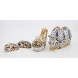 Four Royal Crown Derby gold stopper paperweights including a large white rhino, turtle dove,