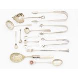 A quantity of silver flatware to include: mustard spoons, sugar sifter, leaf shaped condiment spoon,