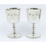 A pair of Modern silver wine goblets, hallmarked by Barker Ellis Silver Co., Birmingham, 1973, 12.38