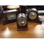 Three mantel clocks. 1. Bravingtons Ltd, Kings Cross, London. Two-train movement, chiming on a gong.
