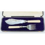 A pair of Victorian silver plated fish servers in fitted case (1)