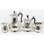 An early 20th Century Electro plated four piece tea and coffee service, wyvern fluted bodies,