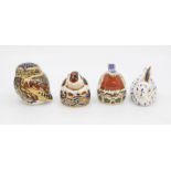 Four Royal Crown Derby gold stopper paperweights with boxes rabbit, owl, gold finch and robin