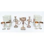 A pair of Victorian style candelabra together with another similar, all with twist stems and