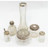 A collection of early 20th Century silver mounted glass bottles to include: scent bottle, vase,