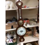 A 19th Century banjo wall barometer in mahogany with some added pieces