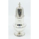 A George V silver caster, baluster shaped with engraved and pierced dome cover, hallmarked by C S
