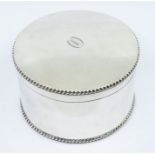 A George V large silver circular box and cover, the cover engraved with initial,   hallmarked by