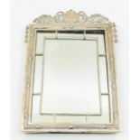 An Edwardian Neo-Classical style silver framed mirror, the frame pediment cast with shell, scrolling