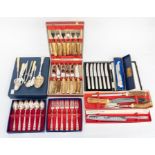 A collection of silver plated items in cases, including Coalport cheese knives etc