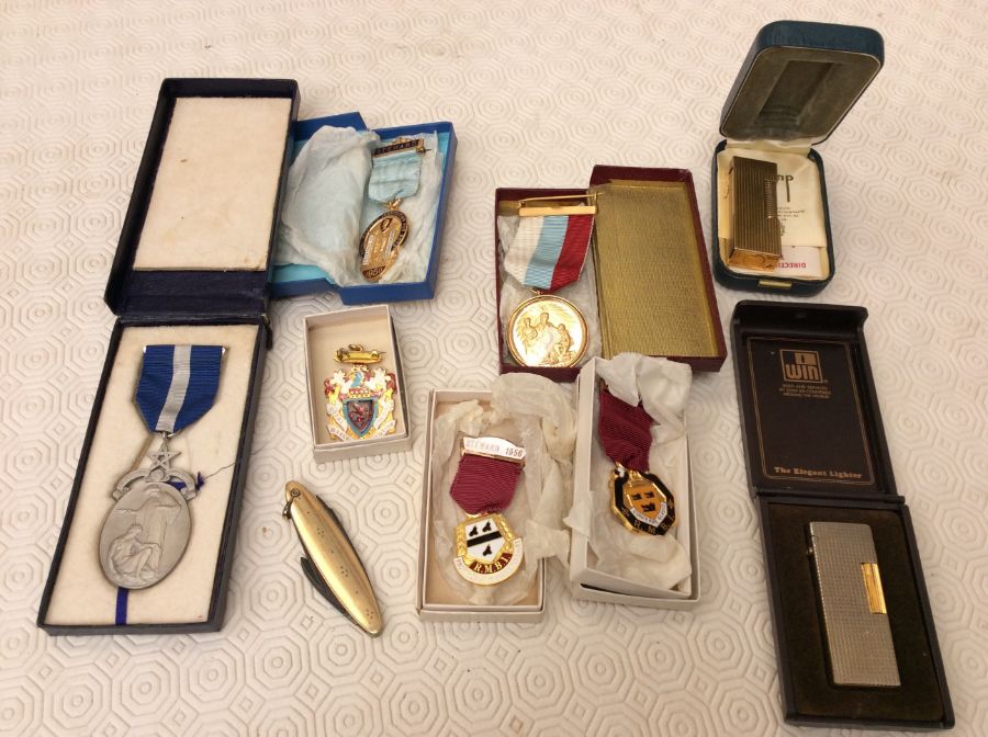 Masonic interest - a silver-gilt medallion on ribbon; four enamelled steward badges, and a white