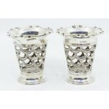 A pair of Edwardian silver tapering openwork vase holders,  pinched wavy border above openwork