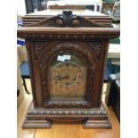 Large late Victorian table clock with Junghans three-train movement, chiming on rods. Contained in