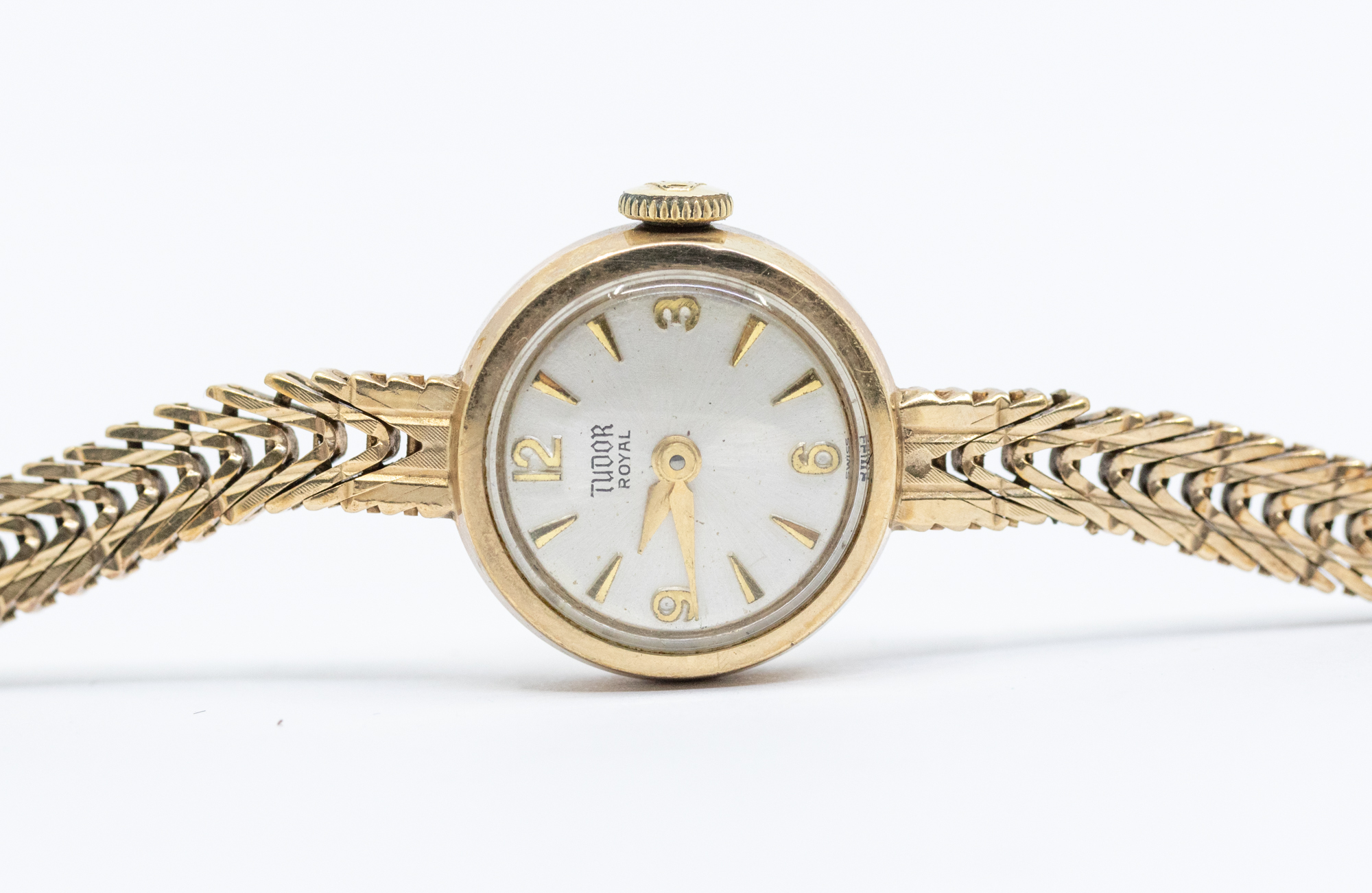 A ladies 9ct gold Tudor Rolex 'Royal' round champagne dial with applied gilt baton markers, dial