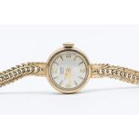 A ladies 9ct gold Tudor Rolex 'Royal' round champagne dial with applied gilt baton markers, dial