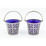 A pair of Edwardian Neo-Classical bon bon baskets in the form of pails, swing handles above beaded