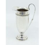 A George VI silver fluted elongated cream jug, hallmarked by Barker Brothers, Birmingham, 1938, 3.71