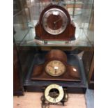 Two mantel clocks and one wall clock for spares or repair. 1. Three-train mantel clock F.H.S.